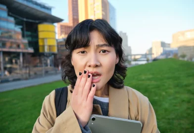 close-up-portrait-girl-with-tablet-looks-worried-concerned-face-expression-feels-sad-someone